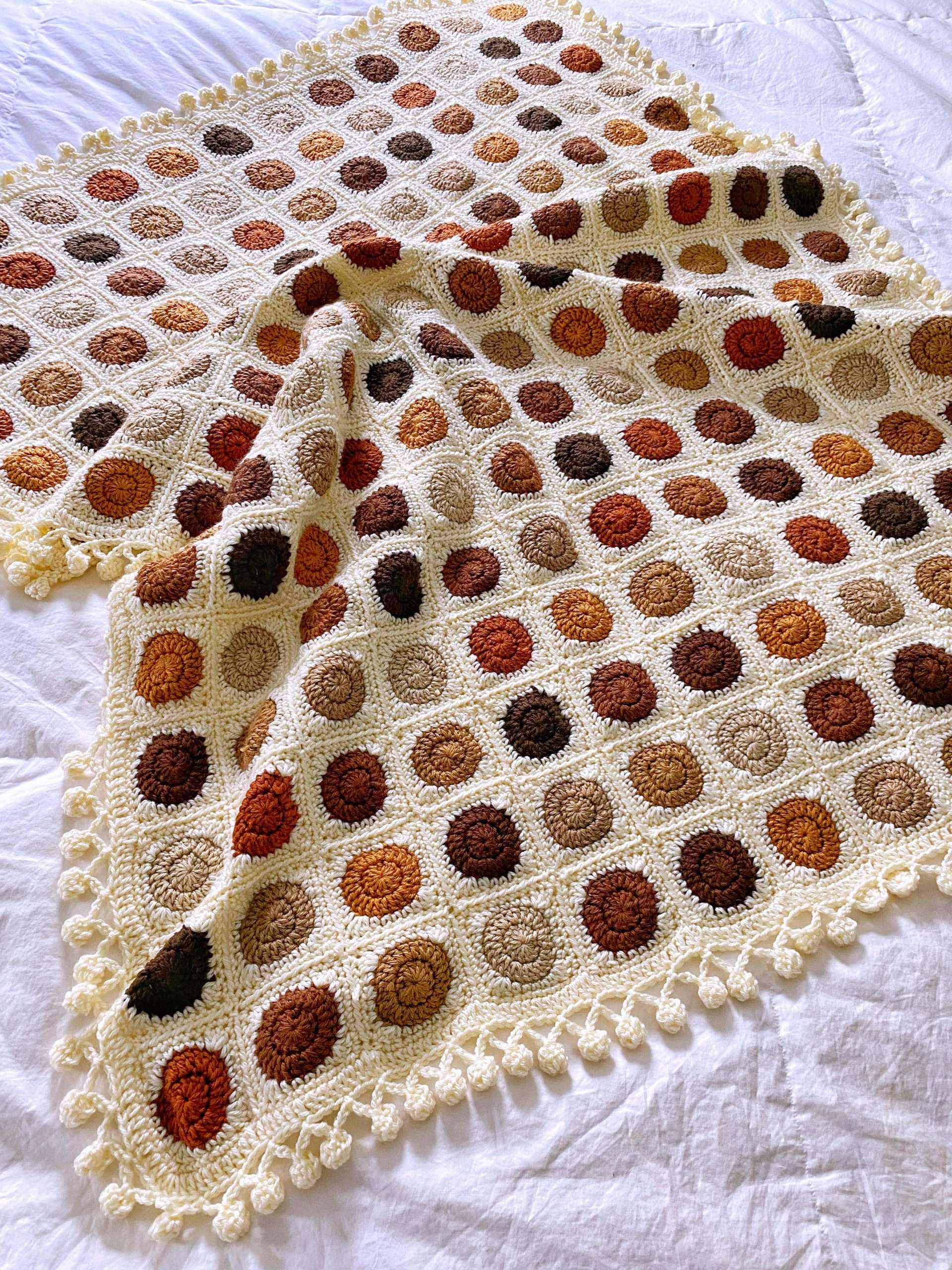 Modern Small Circle Granny Square Blanket using join as You Go and a Pom Pom Border with Lion Brand Skein Tones Yarn