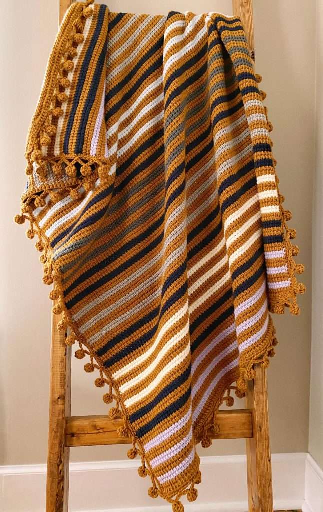 Boho Scrap Yarn Tunisian Striped Blanket Pattern with Pom Pom Border