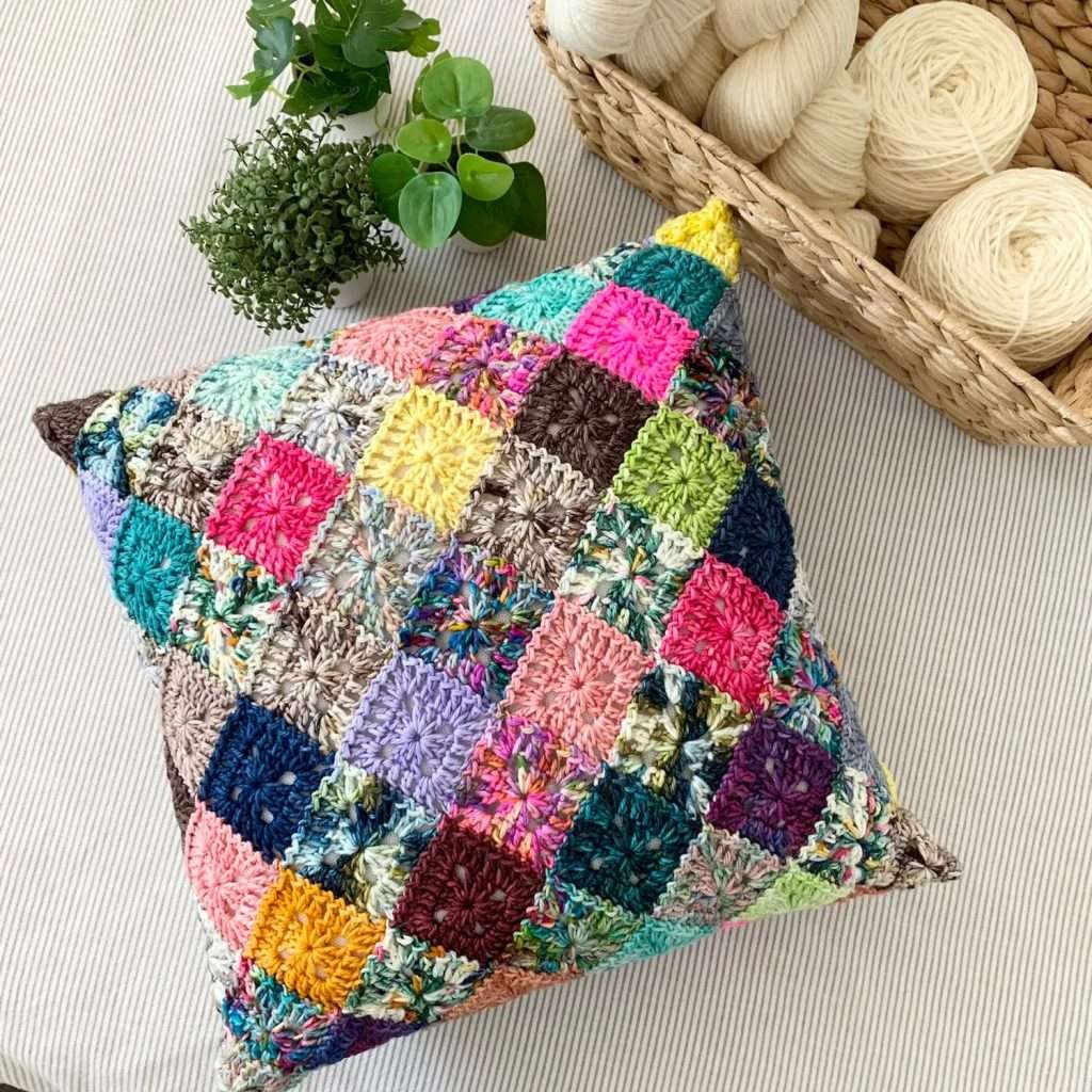 Scrap Granny Squares are Joined to Make a Pillow Cover